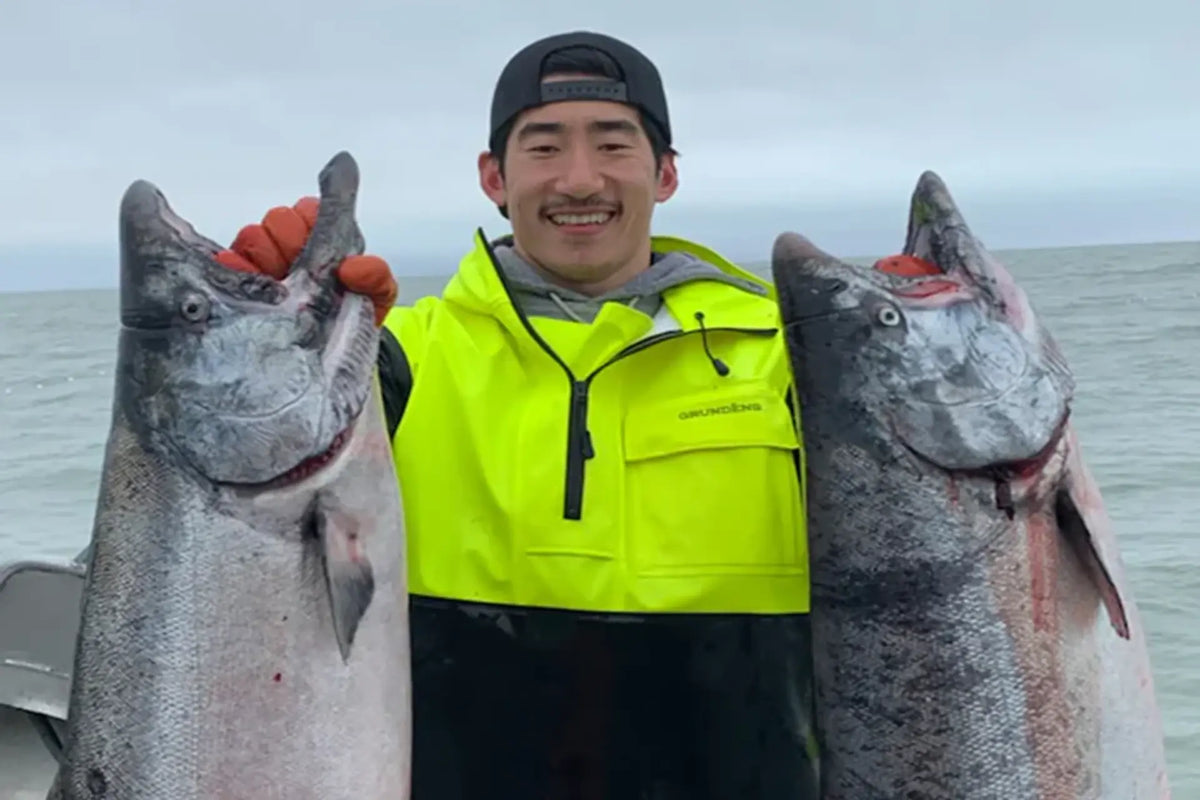 kyle holding two salmon