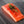 Angled view of raw Wild Alaskan king salmon fillet showcasing marbled flesh and seasoning with thyme on dark wood surface