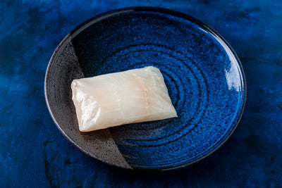 alaskan halibut fillet in a small plate