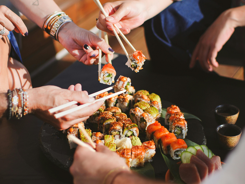 People sharing sushi