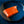 Wild Alaskan sockeye salmon fillet showing vibrant red-orange color and firm texture on a blue ceramic plate
